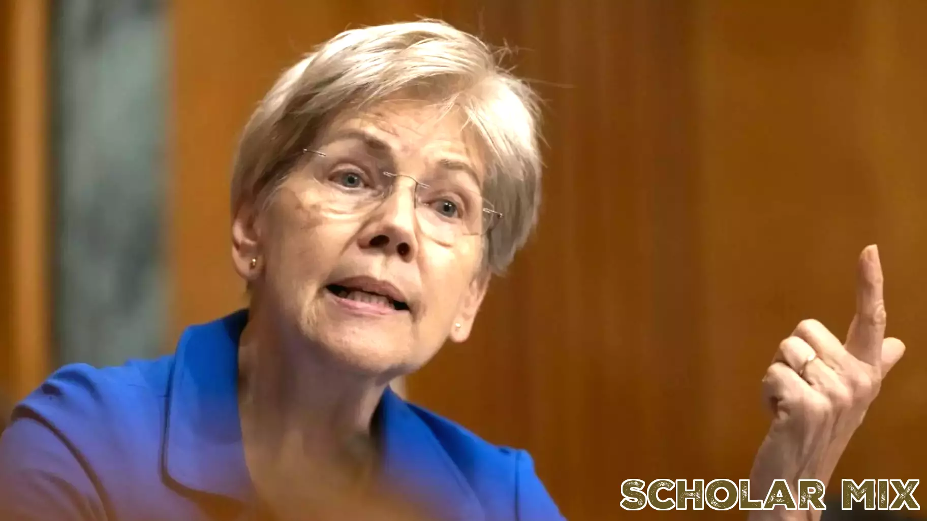 Warren Demands Resignation of Education Secretary McMahon