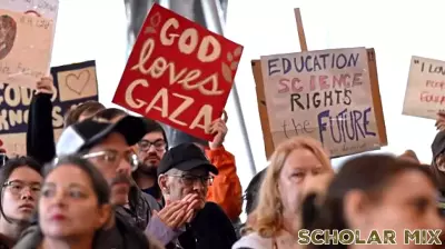 Protesters Rally Against Education Budget Cuts Amidst Heavy Rain